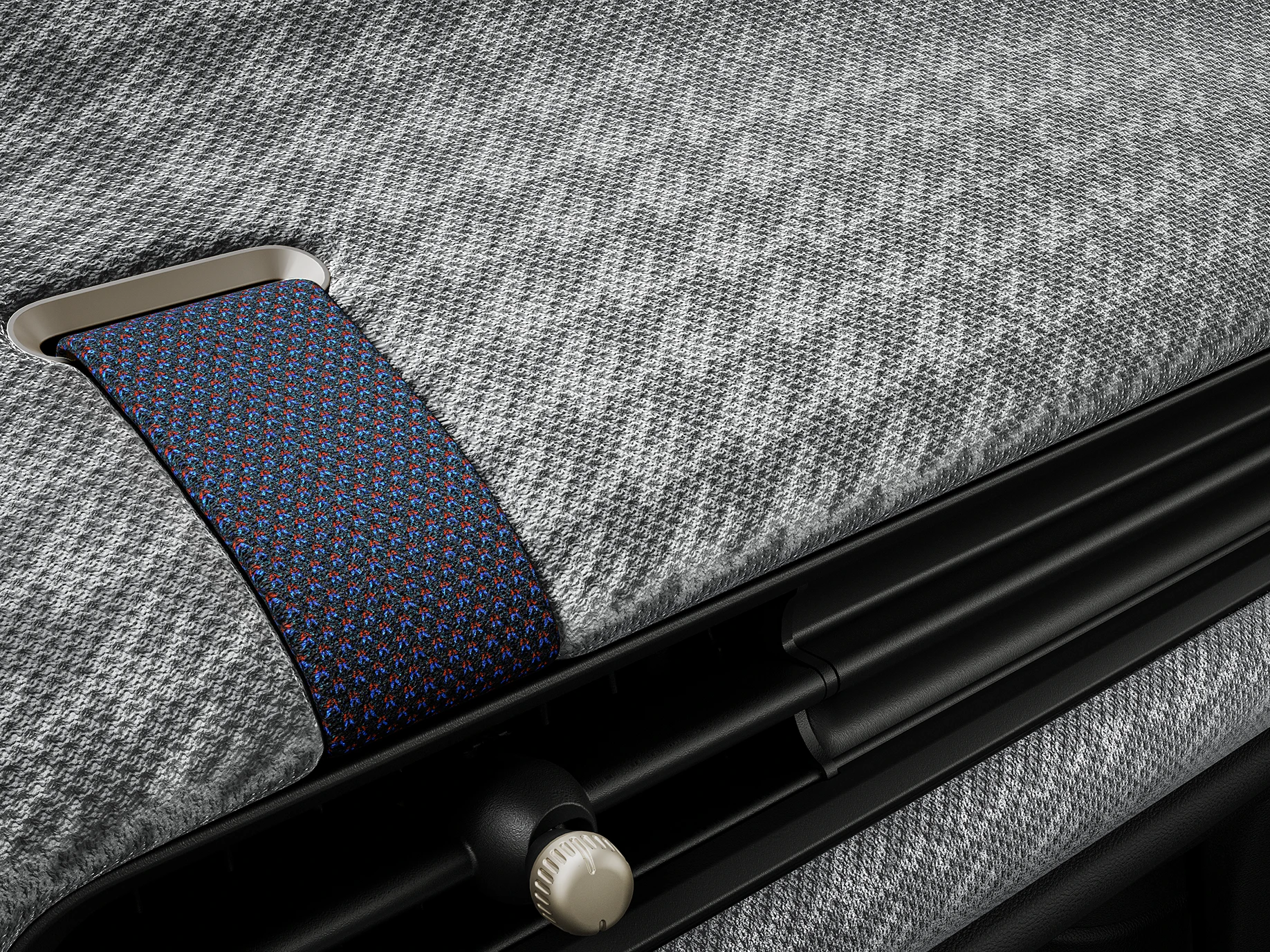 Vue rapprochée du tableau de bord façon tissu tricoté 2D à l’intérieur de la MINI Cooper.